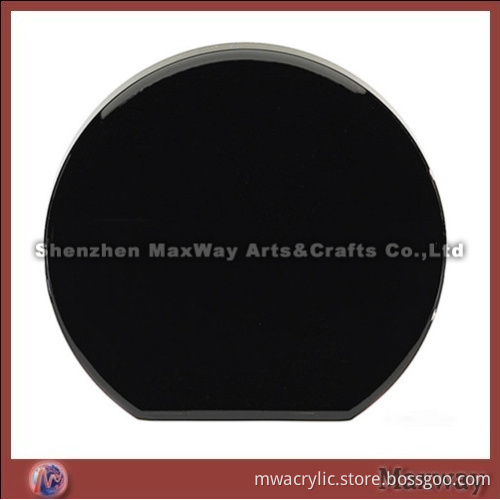 Cylinder-shaped black acrylic paperweight/Block which looks like a chessman